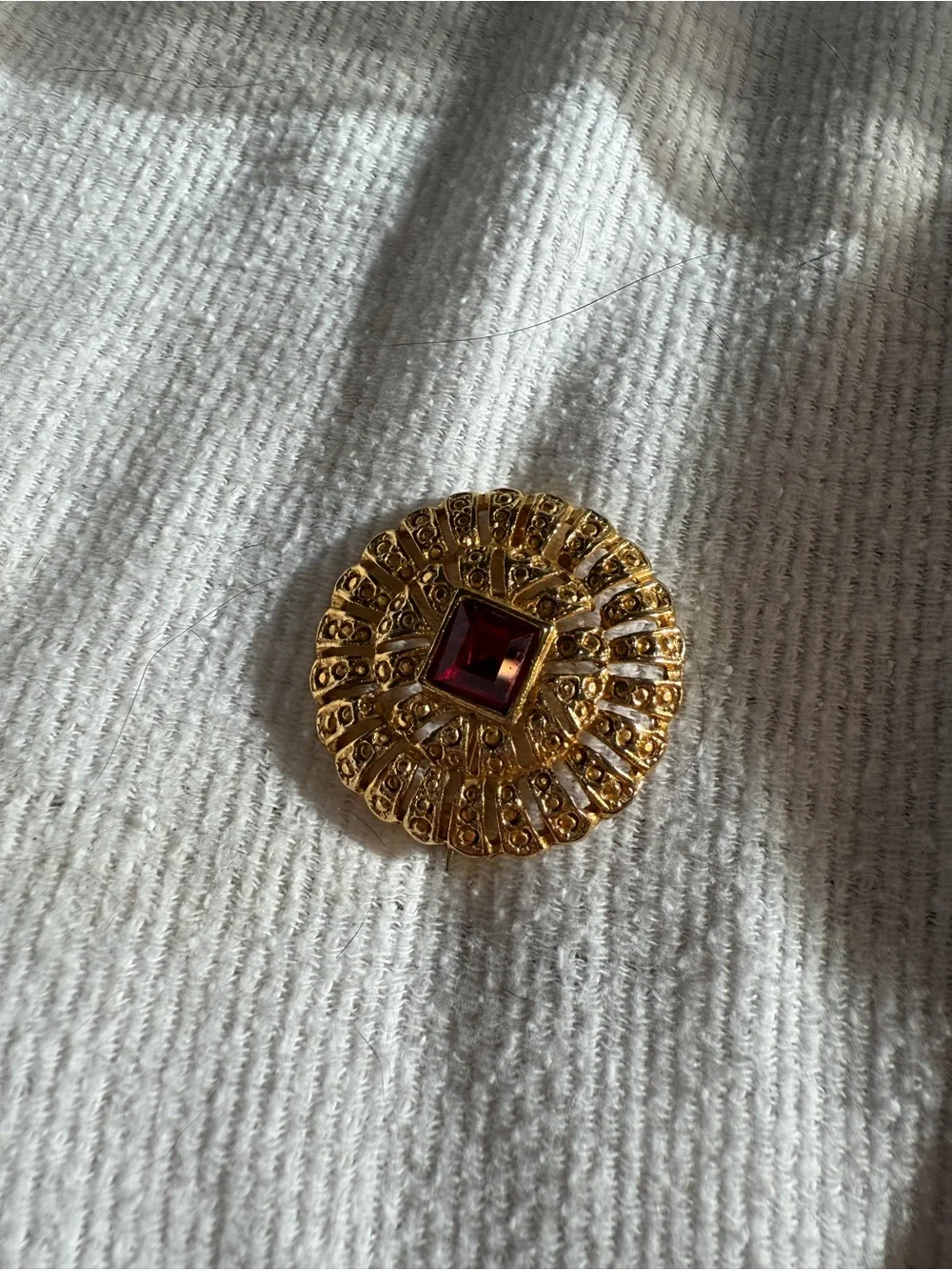 Medieval Romantic Style 1970s Goldtone Brooch with a Ruby Red Stone
